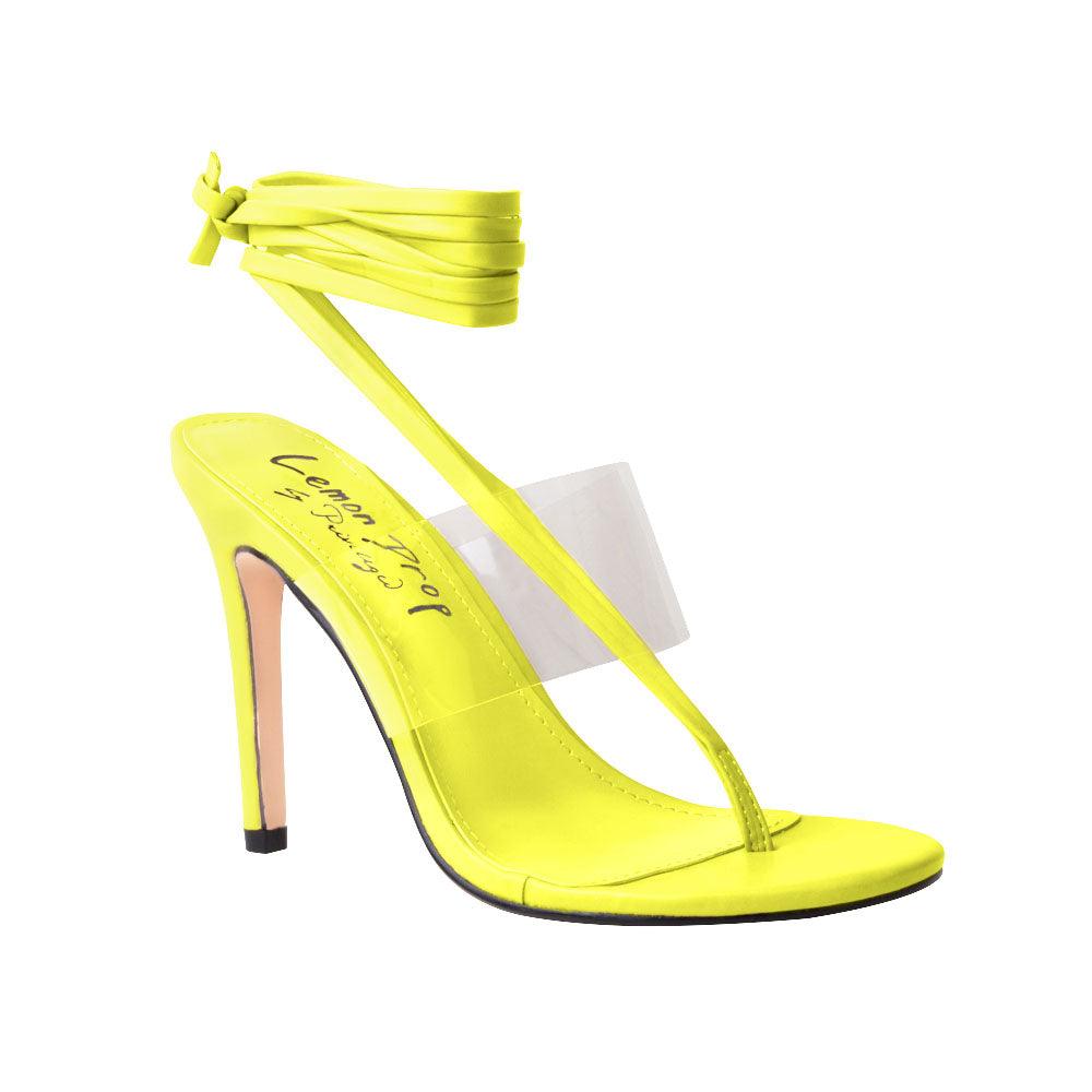 Women's yellow heels with lace tie up clasp and clear strap-corner view