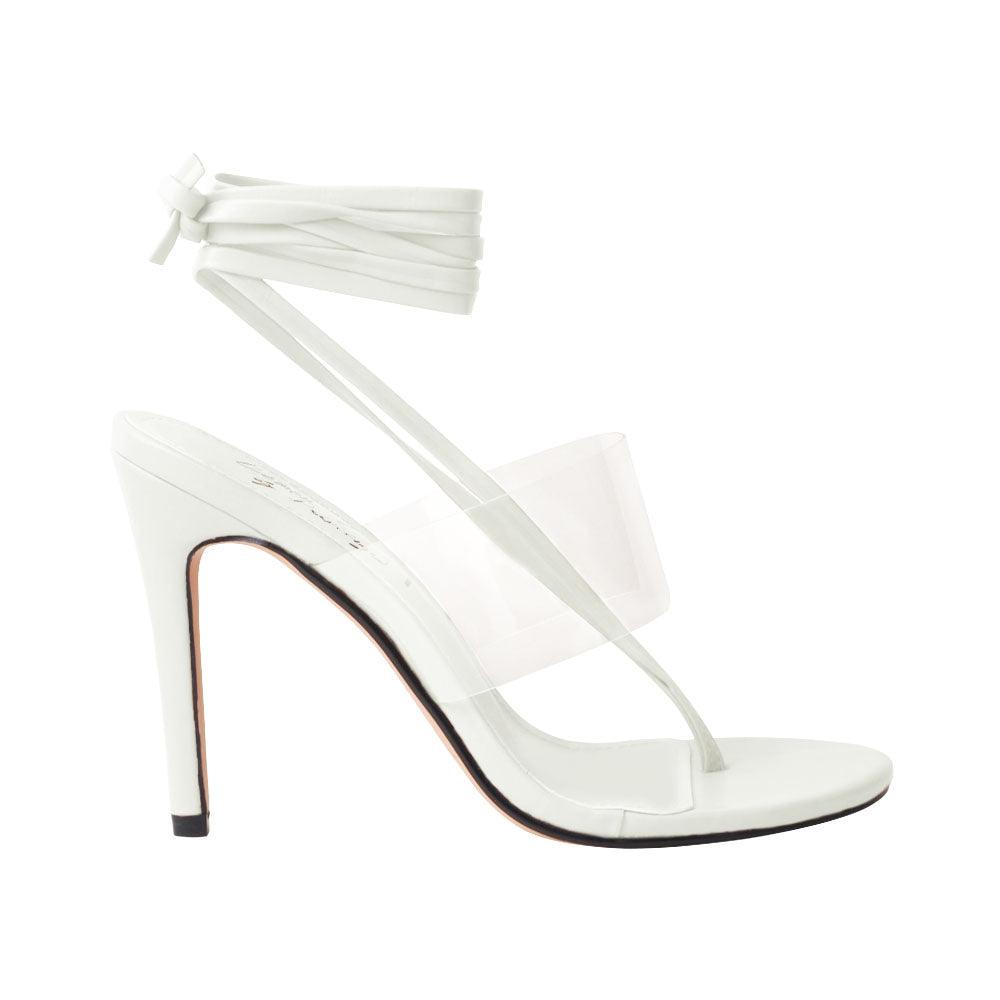 Women's white heels with lace lock up clasp and clear strap-side view