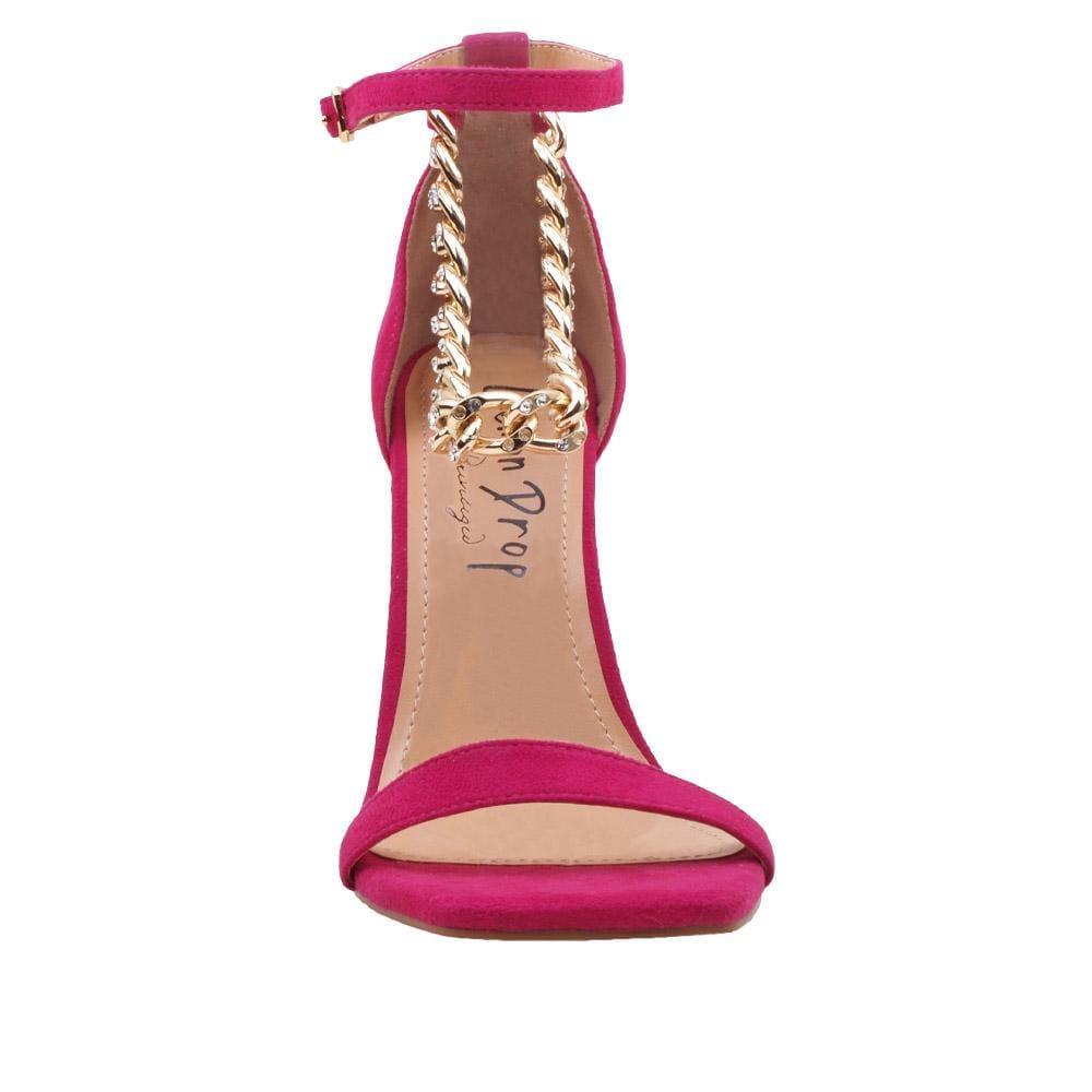 Fuchsia-colored women's high heels with diamond embellished gold chain and ankle buckle fastening-front view