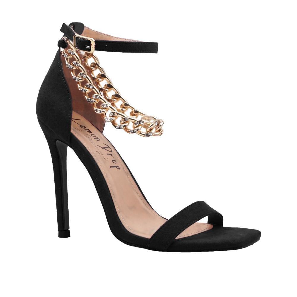 Women's black-colored high heels with a diamond-encrusted gold chain and ankle buckle closure-corner view