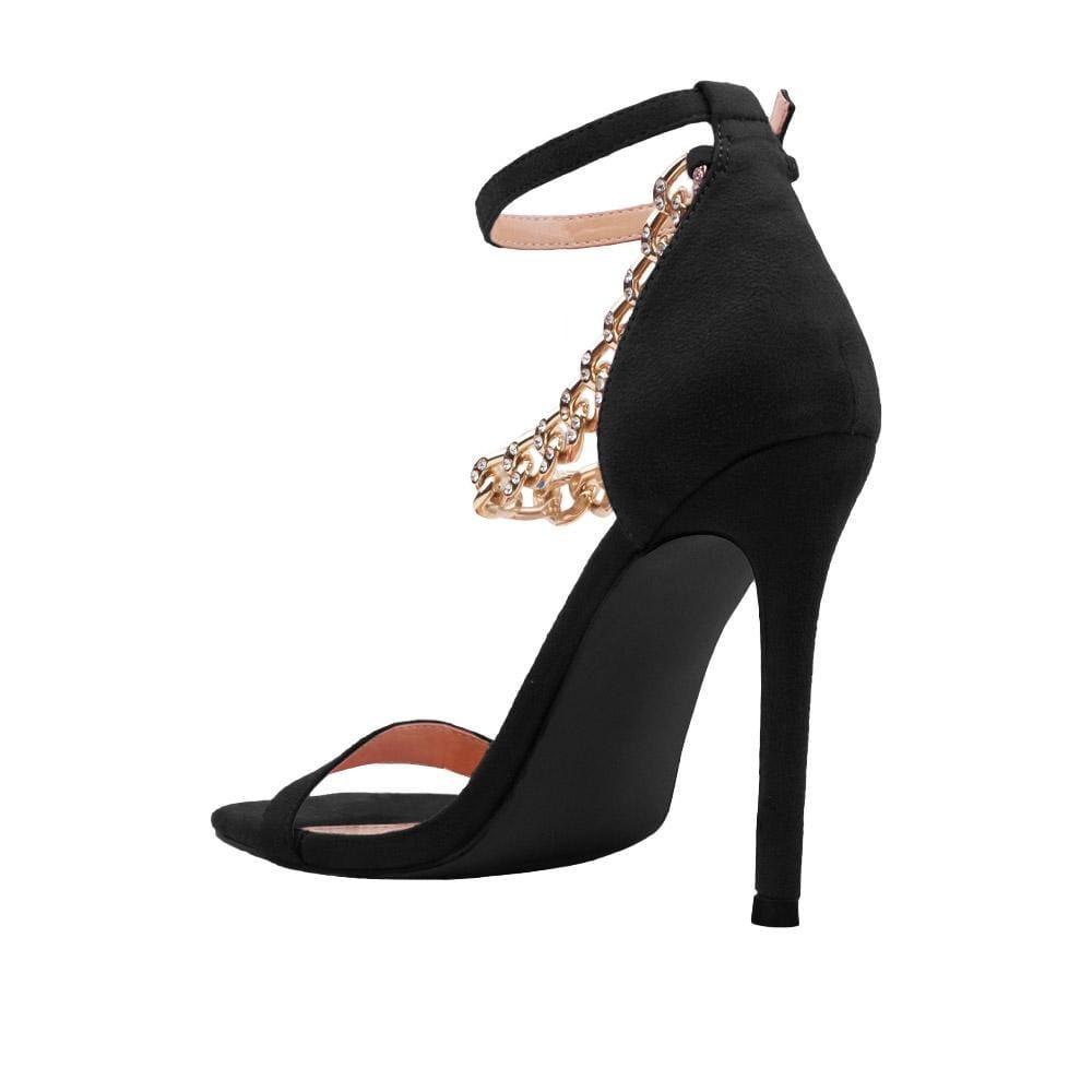 Women's black-colored high heels with a diamond-encrusted gold chain and ankle buckle closure-posterior view