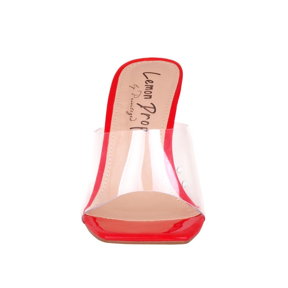 Women's red-colored shoes with transparent block heels and strap-front view