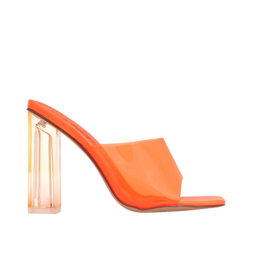 Women's shoes in neon orange-color with transparent block heels and a strap-side view