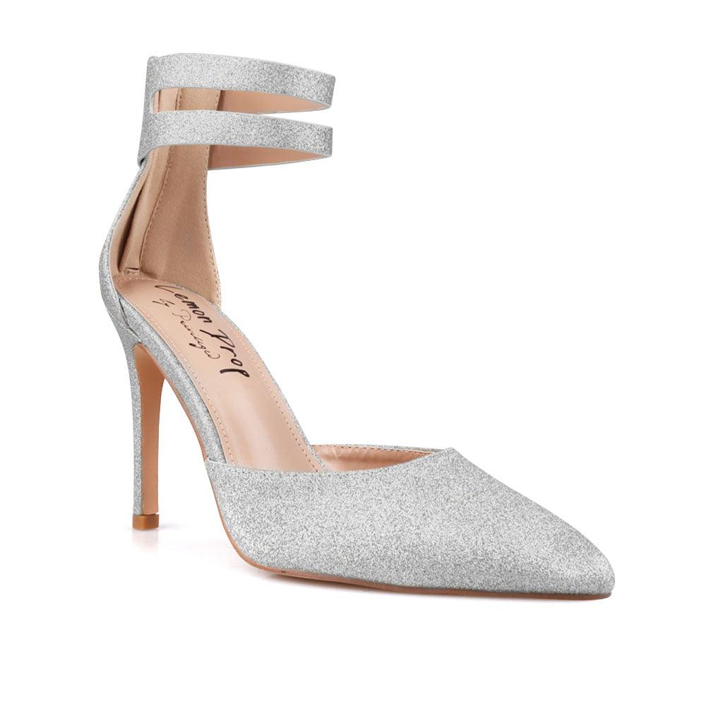 Women's shining silver ankle strap shoes with a closed toe and a back zipper-corner view