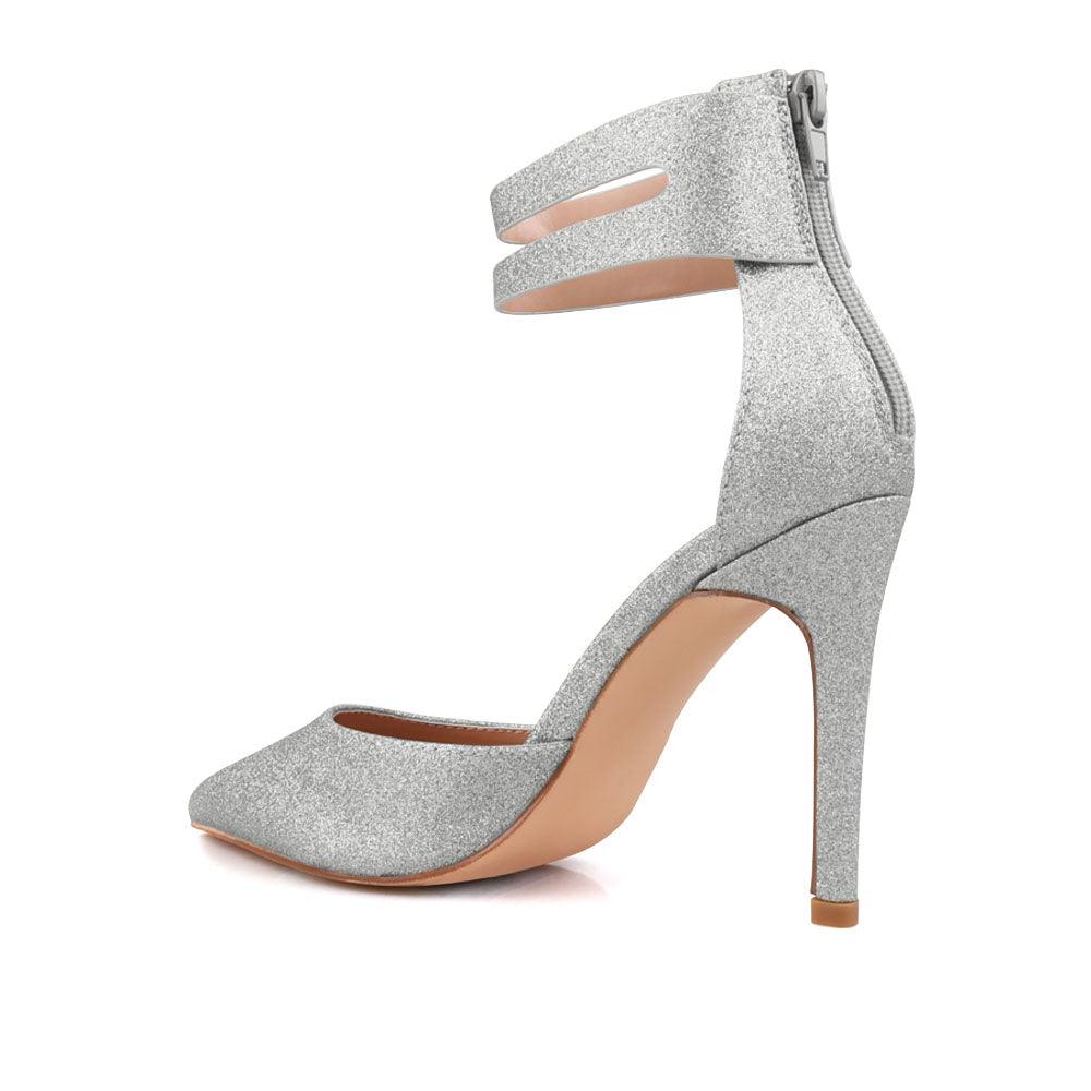 Women's shining silver ankle strap shoes with a closed toe and a back zipper-posterior view