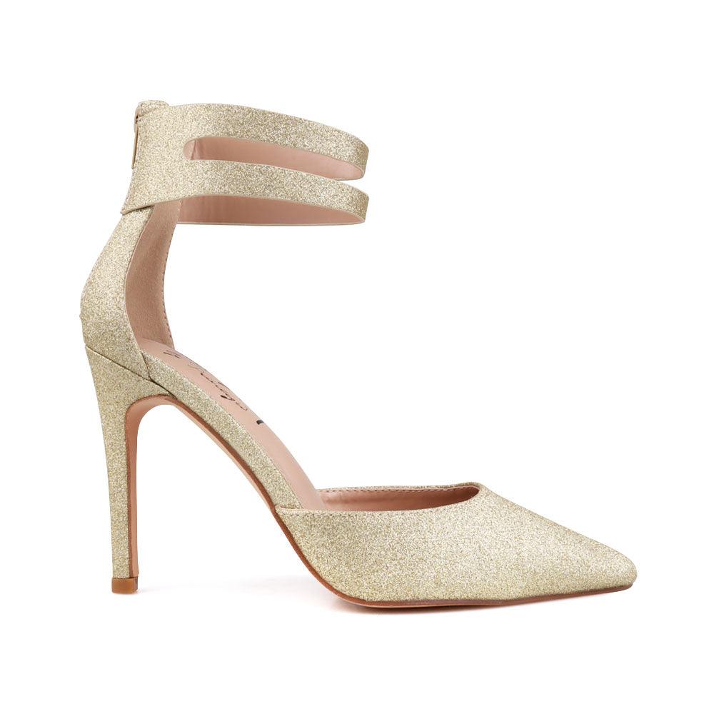 Golden-colored women's double ankle strap shoes with closed toe and back zipper-side view