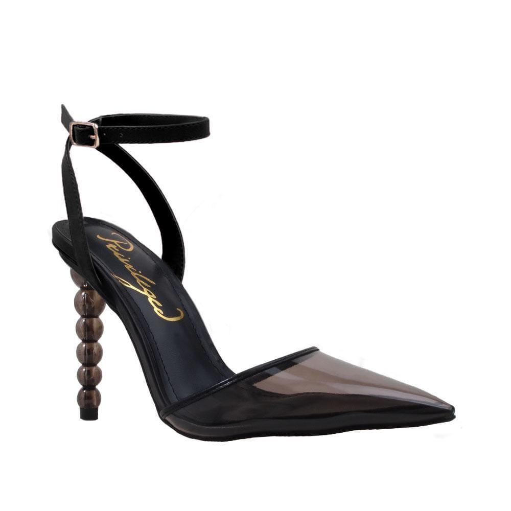 Women's black-colored heels with a closed-toed semi-transparent vinyl top and ankle buckle fastening-corner view