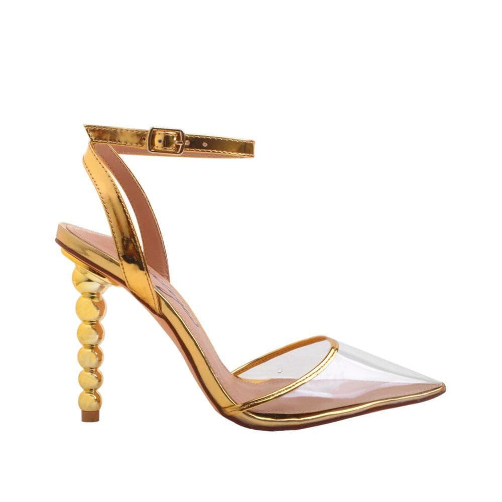 Women's golden-colored shoes with ankle buckle clasp and semi-transparent vinyl closed-toe top-side view