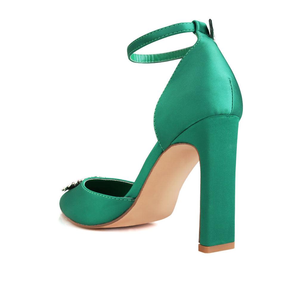 Green-colored women's heel with closed toe design upper and ankle buckle fastening-posterior view