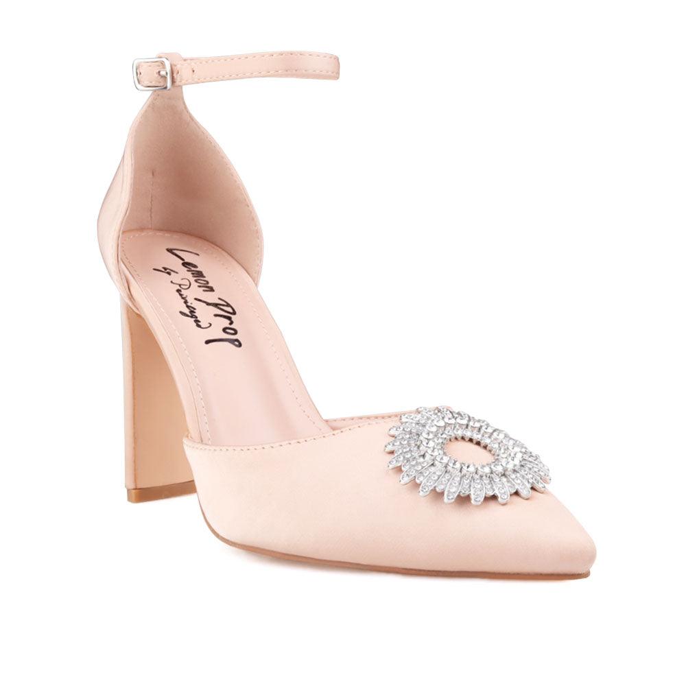 Nude-colored women's heel with closed toe dazzling design top and ankle buckle fastening-corner view