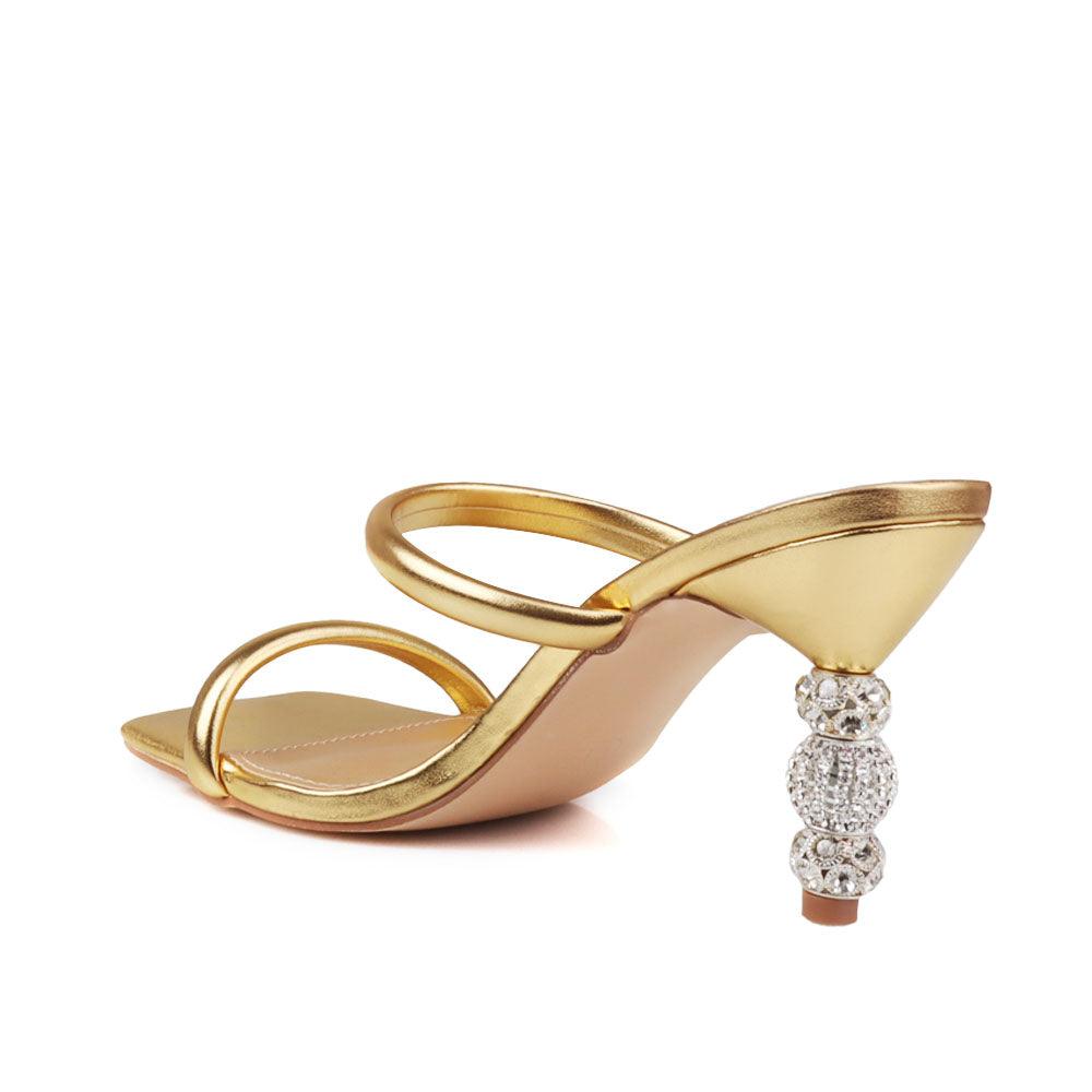 Golden-colored open-toed heels for women with a double strap and a slip-on design-posterior view