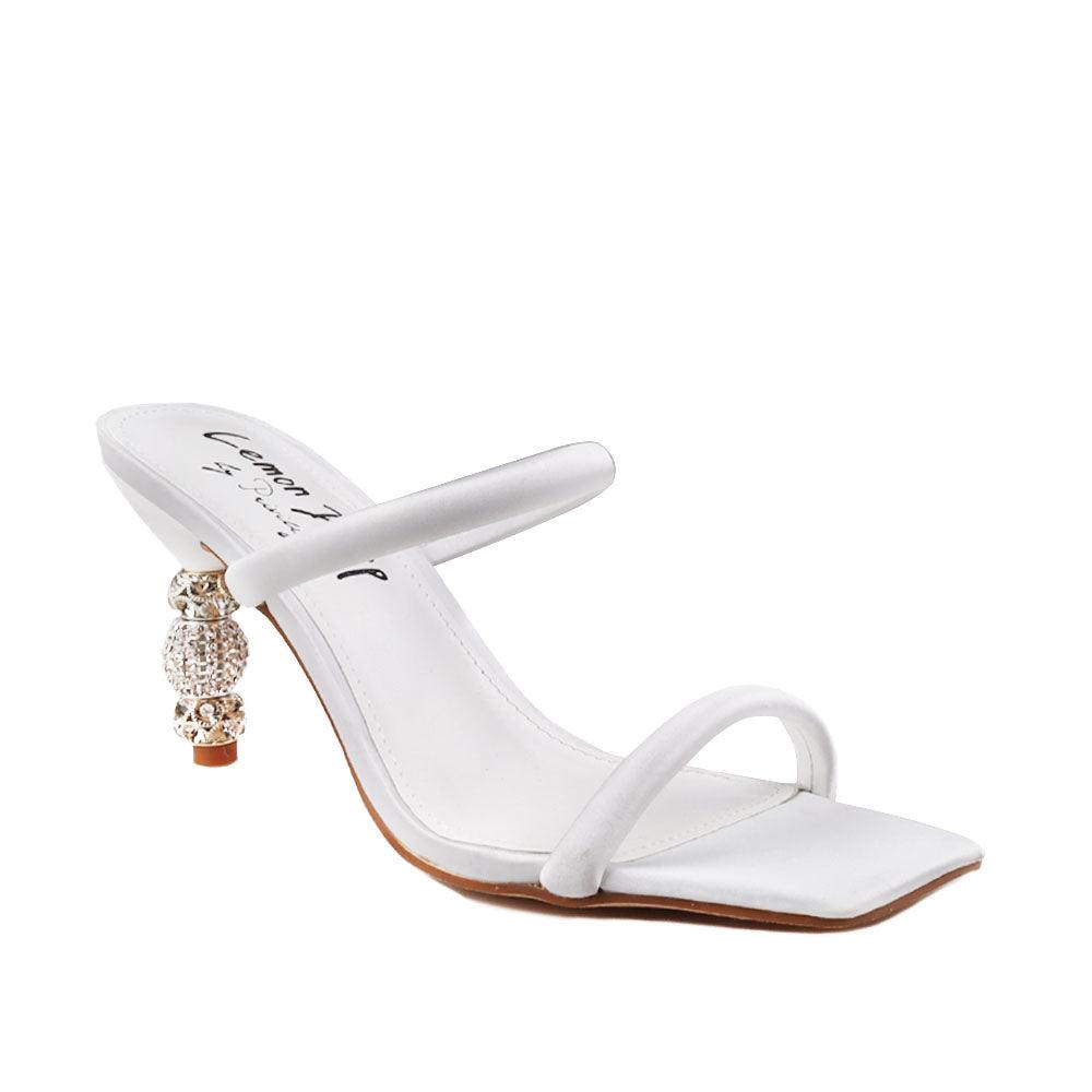 White-colored open toed women's heels with double strap and slip on style-corner view