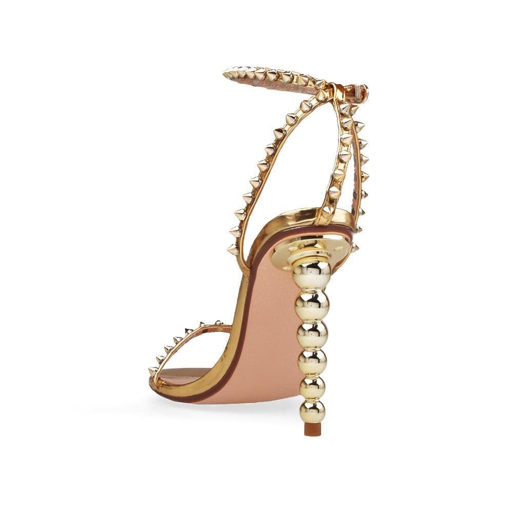 Open-toed pearled shoes for women in gold with a metallic studded ankle buckle clasp-posterior view