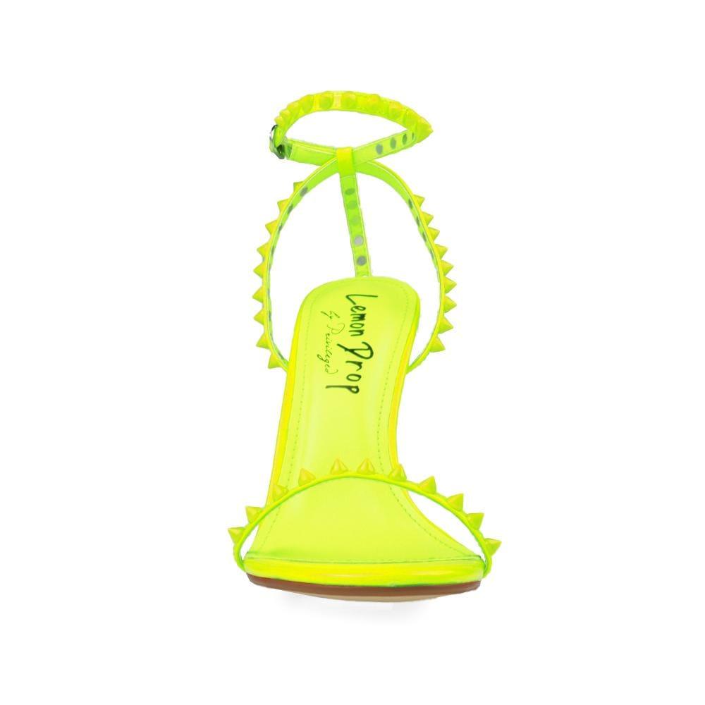 Women's neon yellow open-toed pearled shoes with a metallic studded ankle buckle clasp-front view