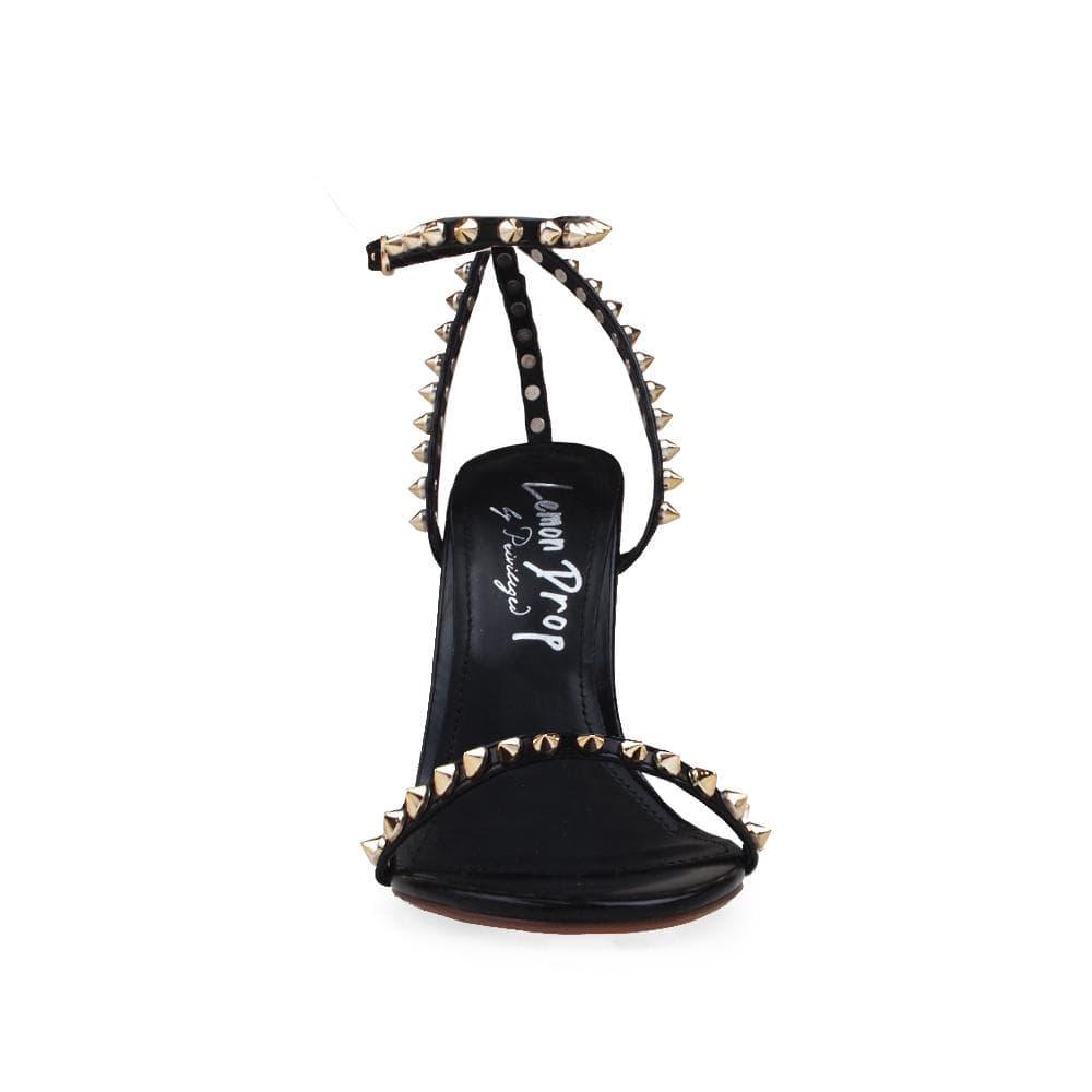 Women's open-toed pearled heels in black with a gold metallic studded ankle buckle fastening.-front view