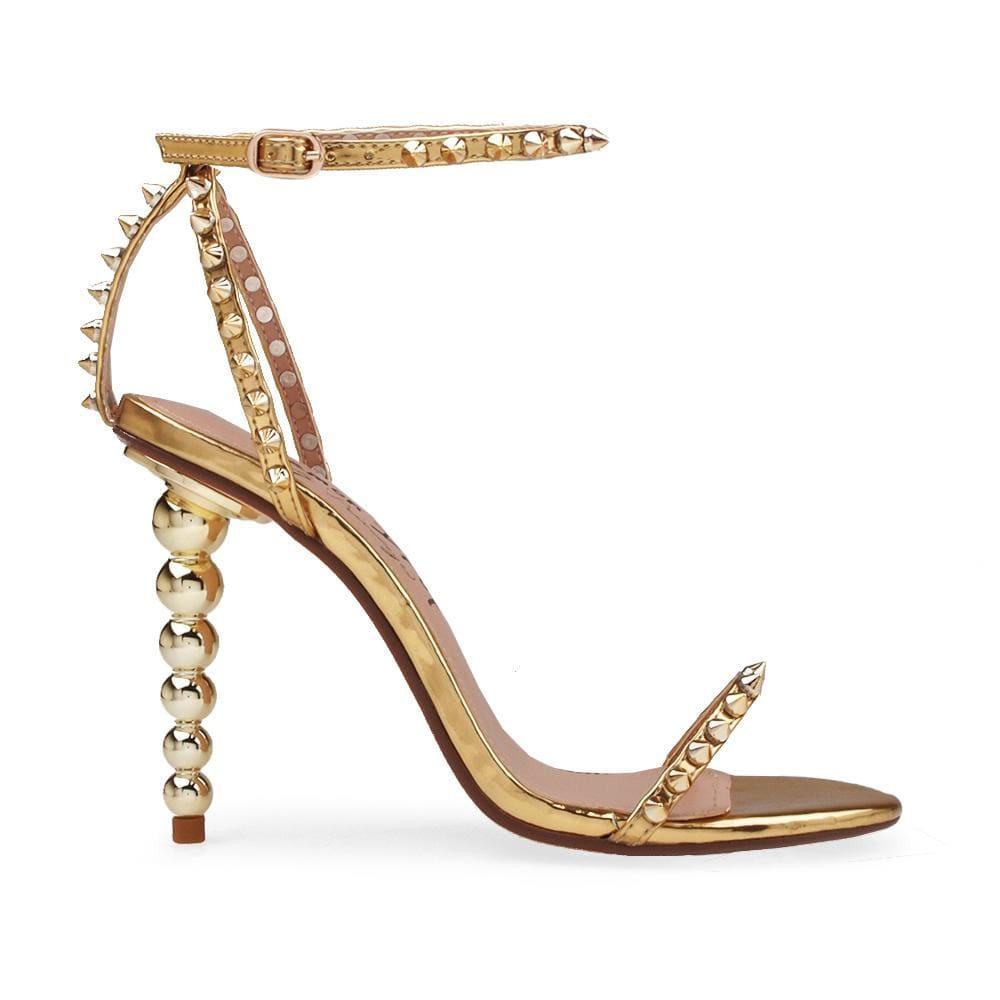 Open-toed pearled shoes for women in gold with a metallic studded ankle buckle clasp-side view