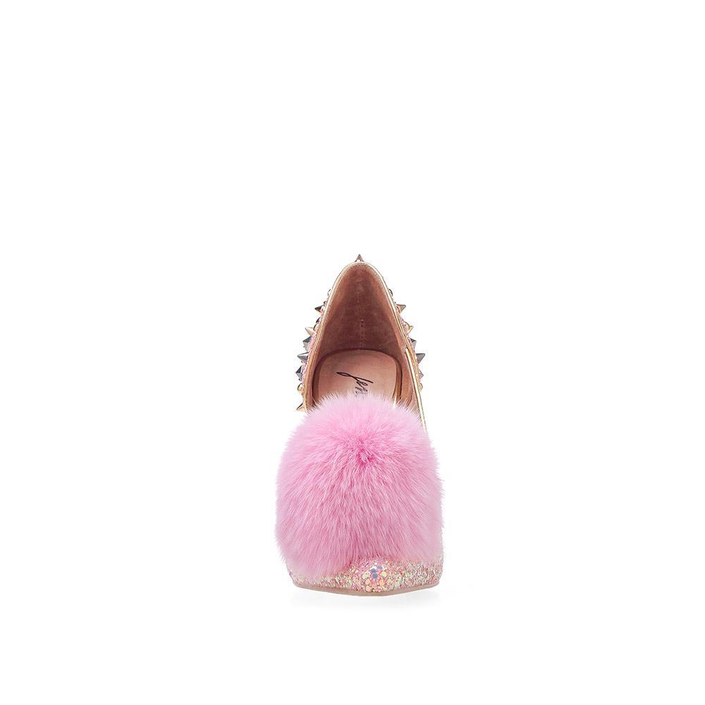 Pink-colored front fur pom women's pointed heels with metallic spike stud accents and slip on design-front view