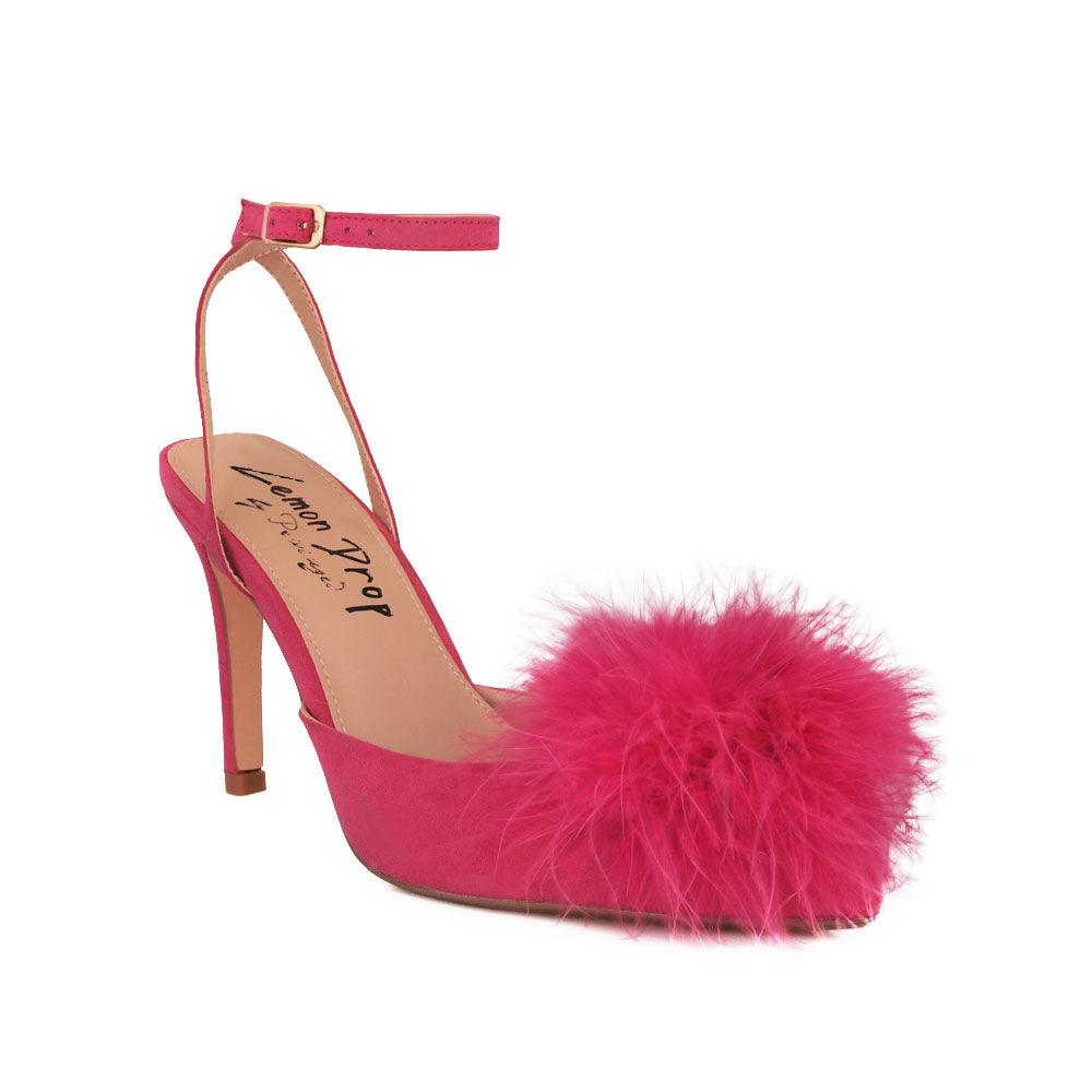 Women's fuchsia-colored pointed-toe heels with front fur pom top and ankle buckle closure-corner view