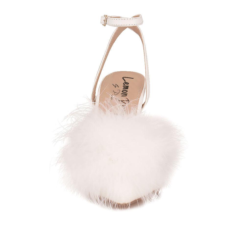 Women's white-colored pointed-toe heels with front fur pom top and ankle buckle fastening-front view