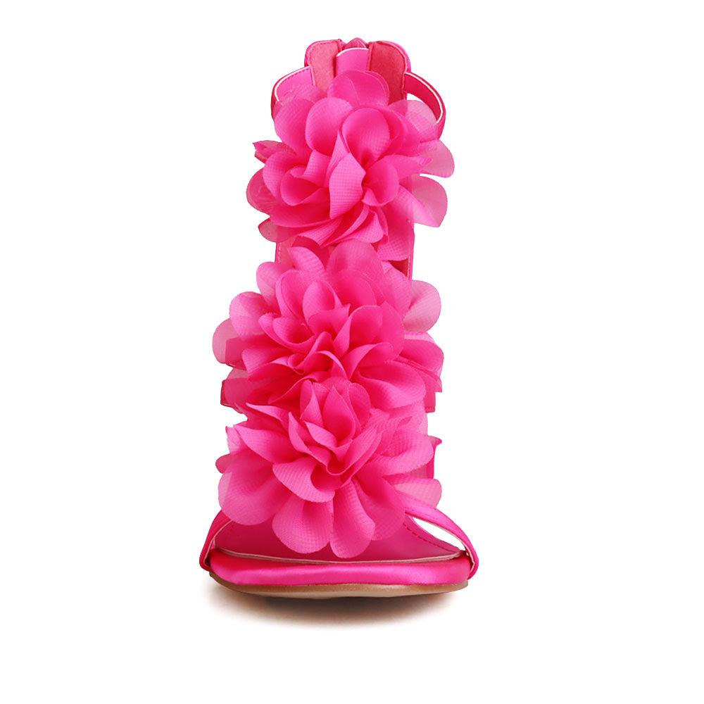 Women's fuchsia-colored heels featuring a satin extravagant floral strapped top and rear zipper clasp-front view