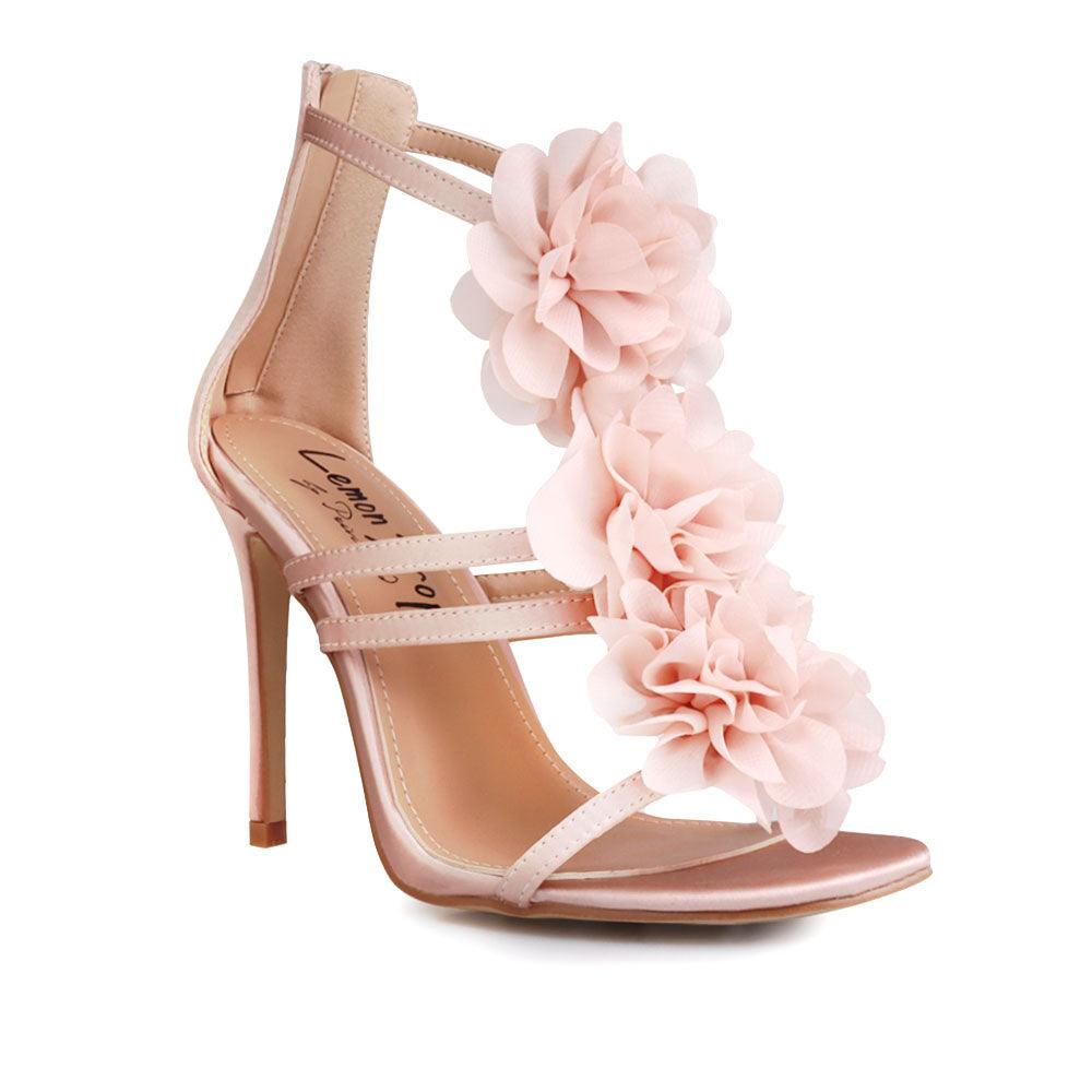 Women's nude-colored shoes with satin floral strapped top and back zipper closure-corner view