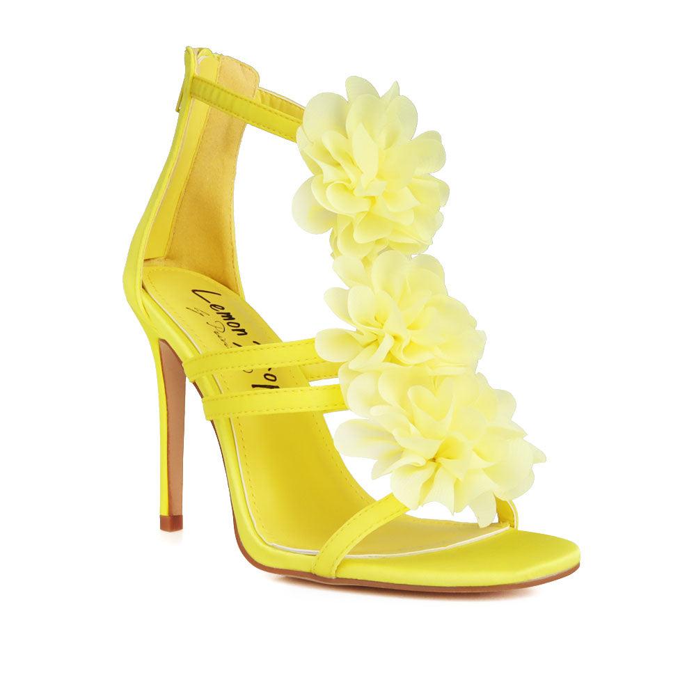 Yellow-colored women's heels with satin opulent floral strapped upper and back zipper closure-corner view