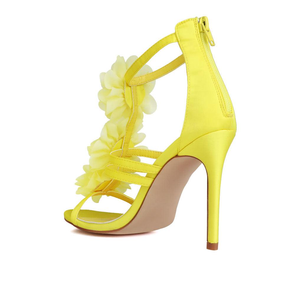 Yellow-colored women's heels with satin opulent floral strapped upper and back zipper closure-posterior view