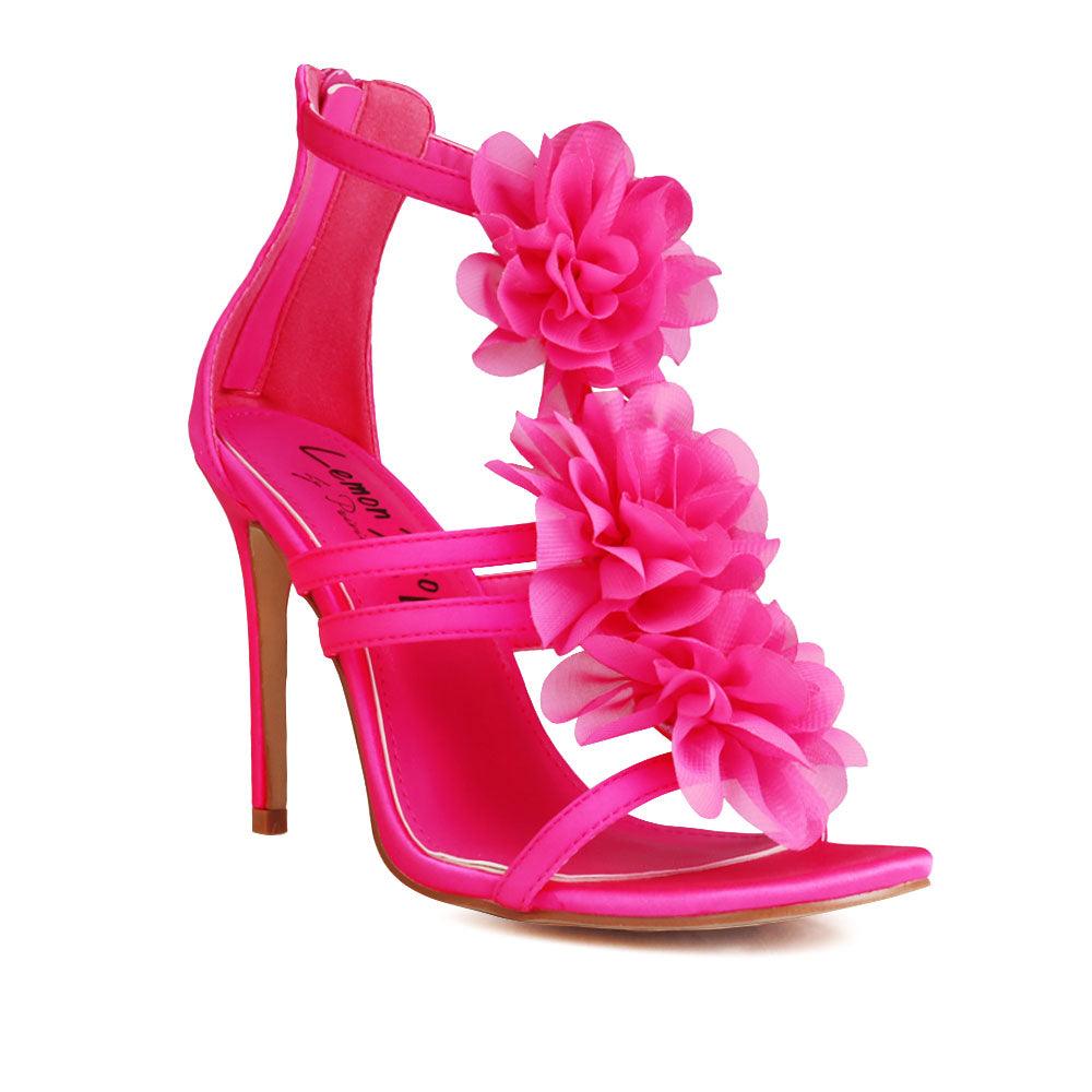 Women's fuchsia-colored heels featuring a satin extravagant floral strapped top and rear zipper clasp-corner view