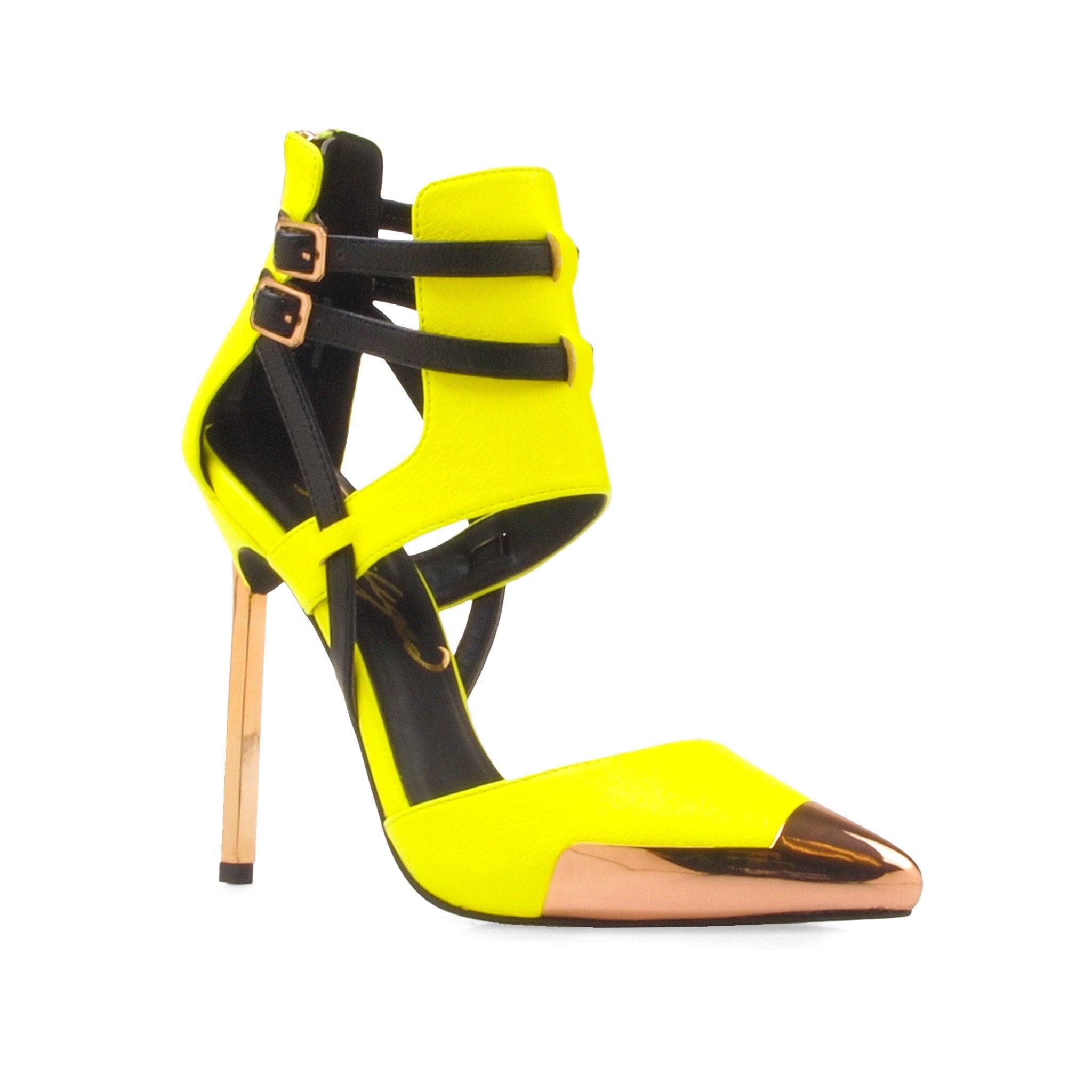 Yellow-colored women's ankle heels with black double ankle buckle closure and golden pointed toe-corner view