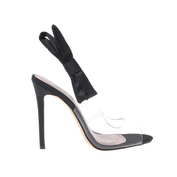 Black-colored women's heels featuring clear vinyl upper with satin bow back sling closure