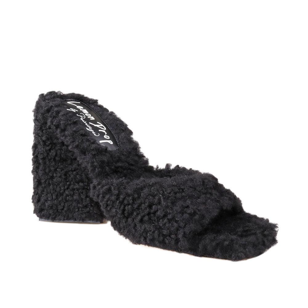 Women's open-toed black-colored block heels with shearling top and slide-in design-corner view