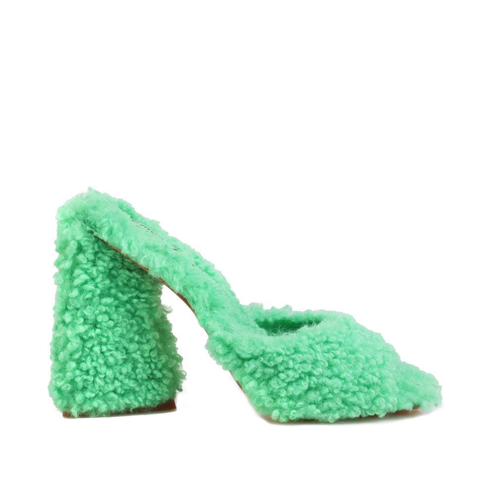 Open toed green-colored women's block heel shoes with shearling upper and slide in design-side view