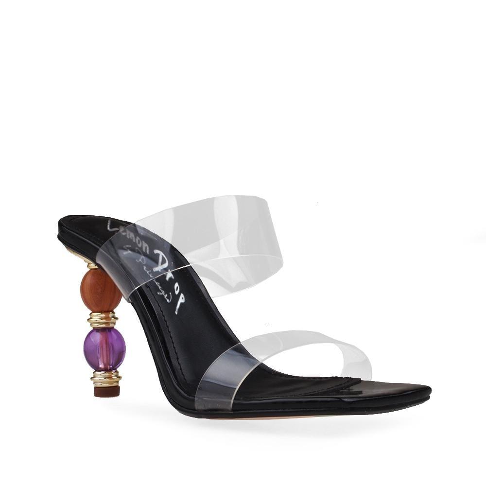 Black colored women heels with clear vinyl top and colorful heel-corner view