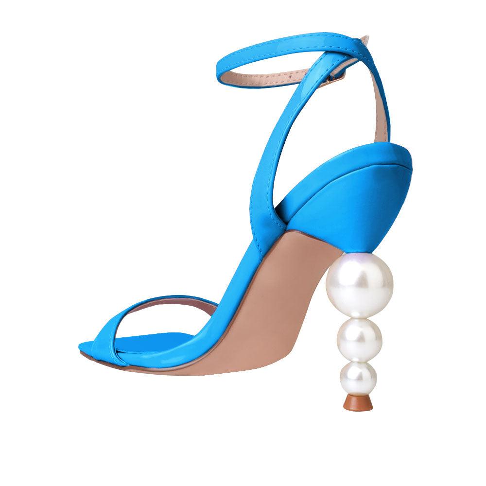 Blue colored women heels with ankle buckle closure and three tiered pearl heel-posterior view