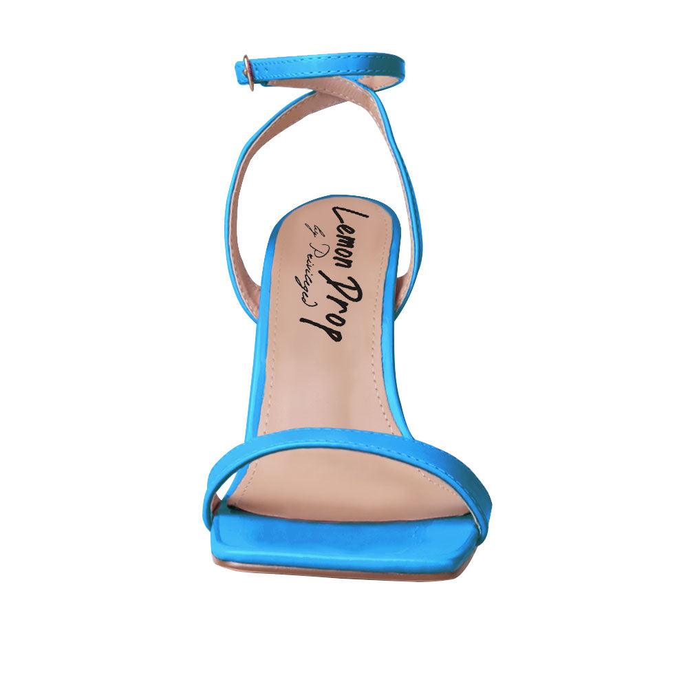 Blue colored women heels with ankle buckle closure and three tiered pearl heel-front view