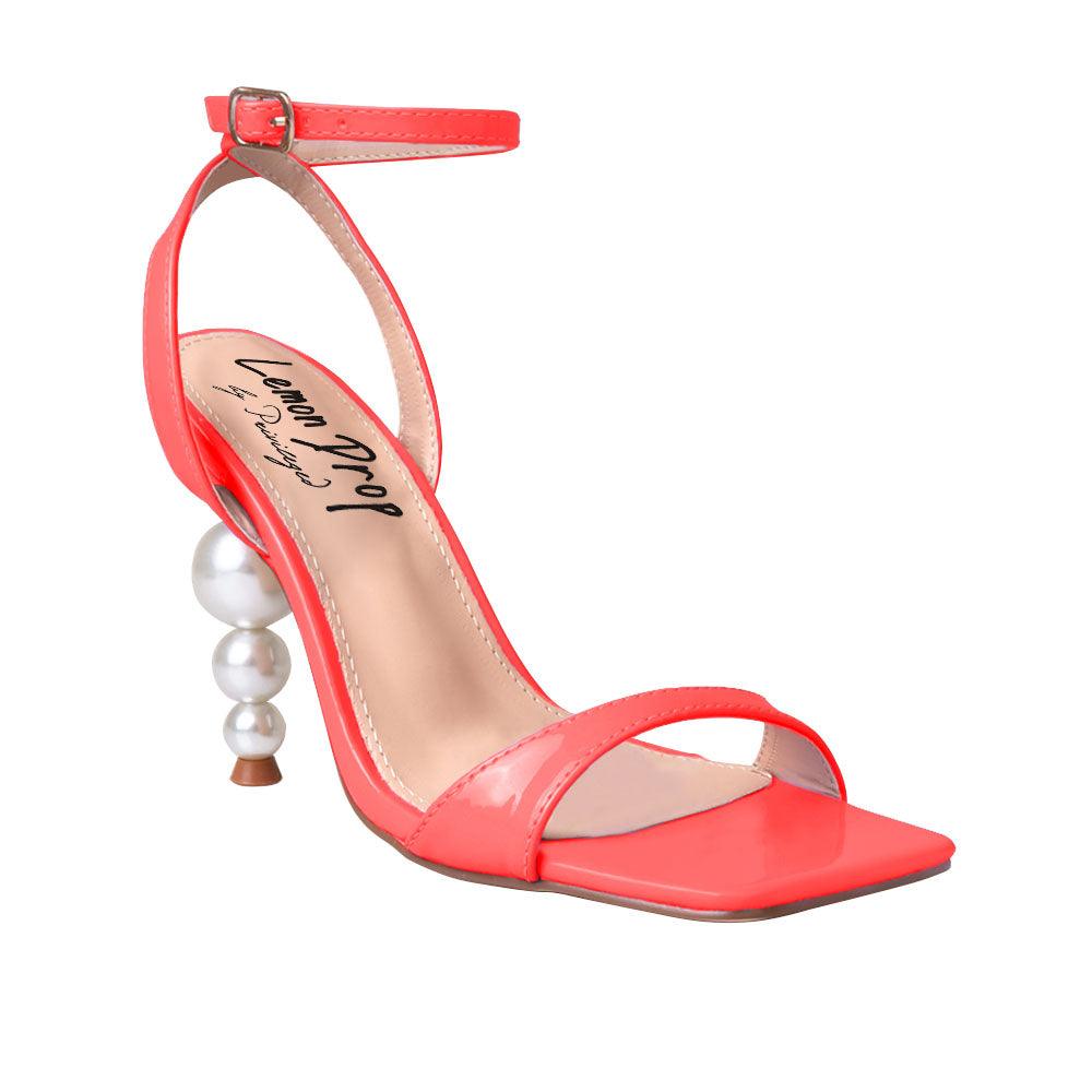 Red colored women heels with ankle buckle closure and three tiered pearl heel-corner view