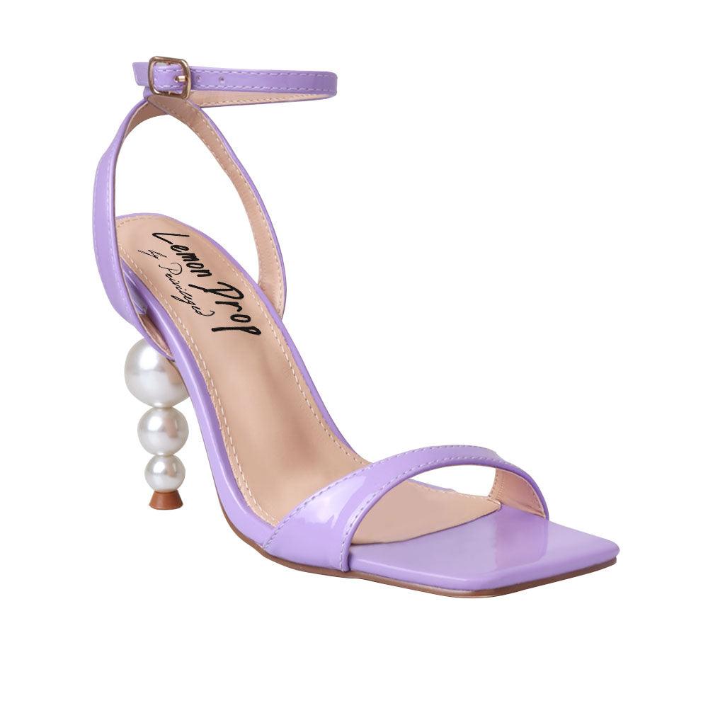 Purple colored women heels with ankle buckle closure and three tiered pearl heel-corner view