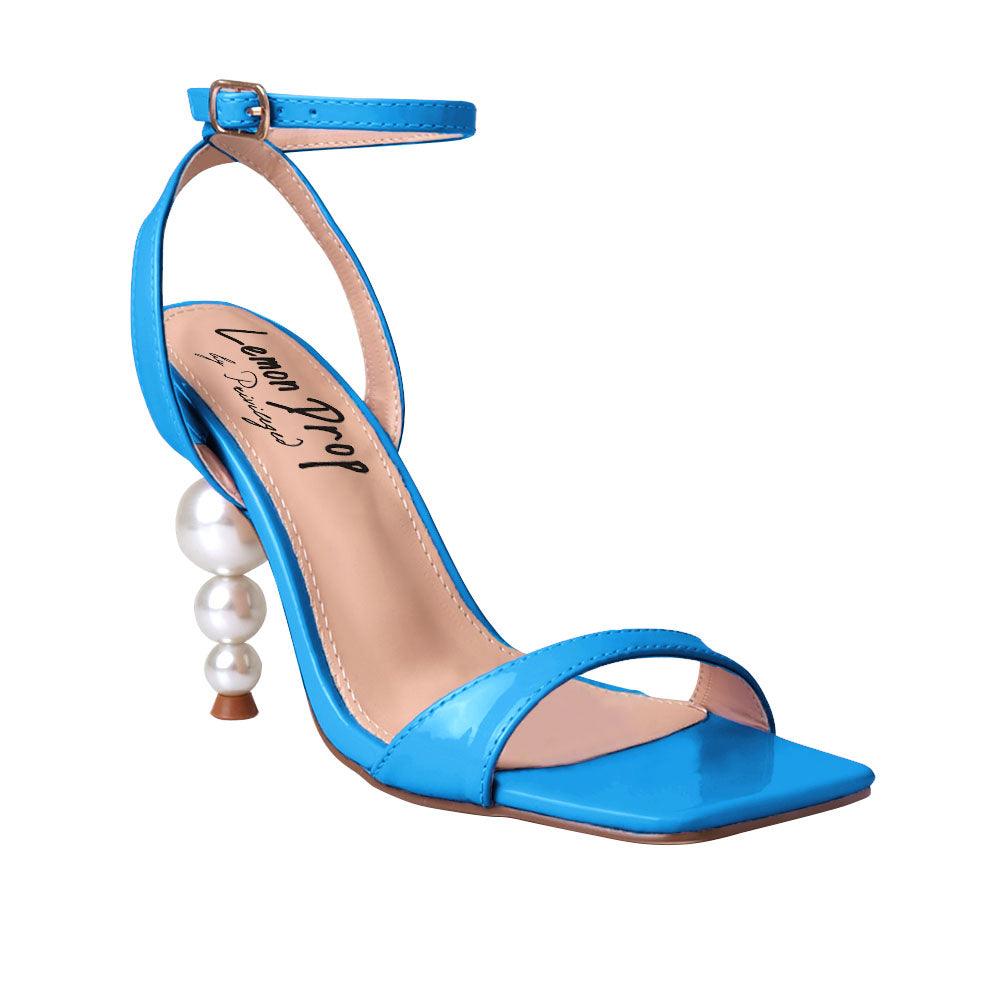 Blue colored women heels with ankle buckle closure and three tiered pearl heel-corner view