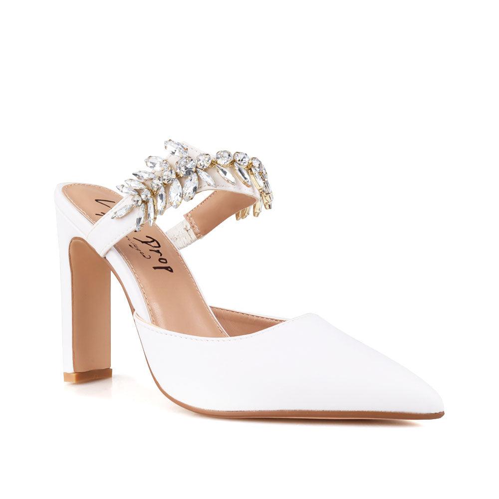 White colored women heels with slip-on desgin and a silver motive strap-corner view