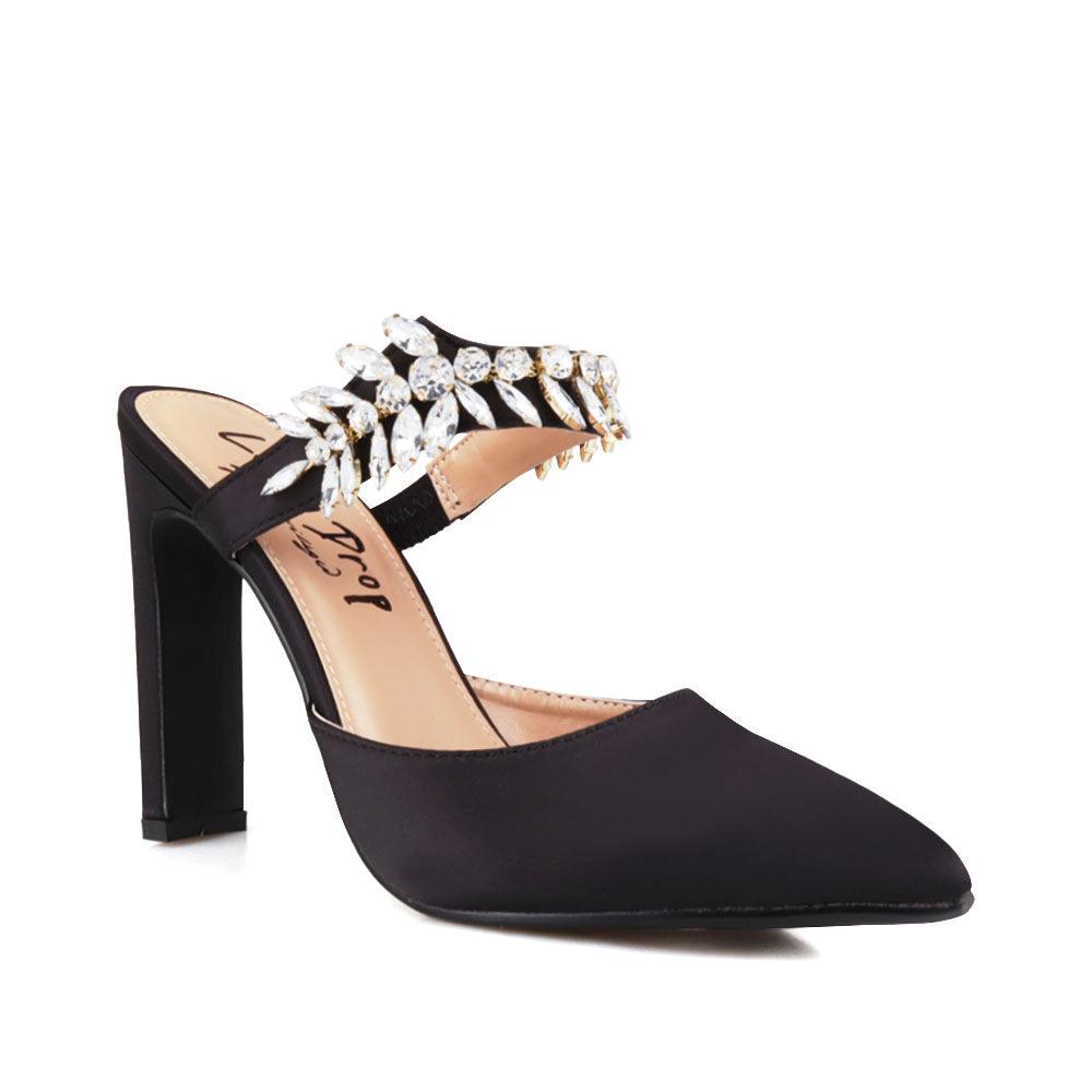 Black colored women heels with slip-on desgin and a silver motive strap-corner view