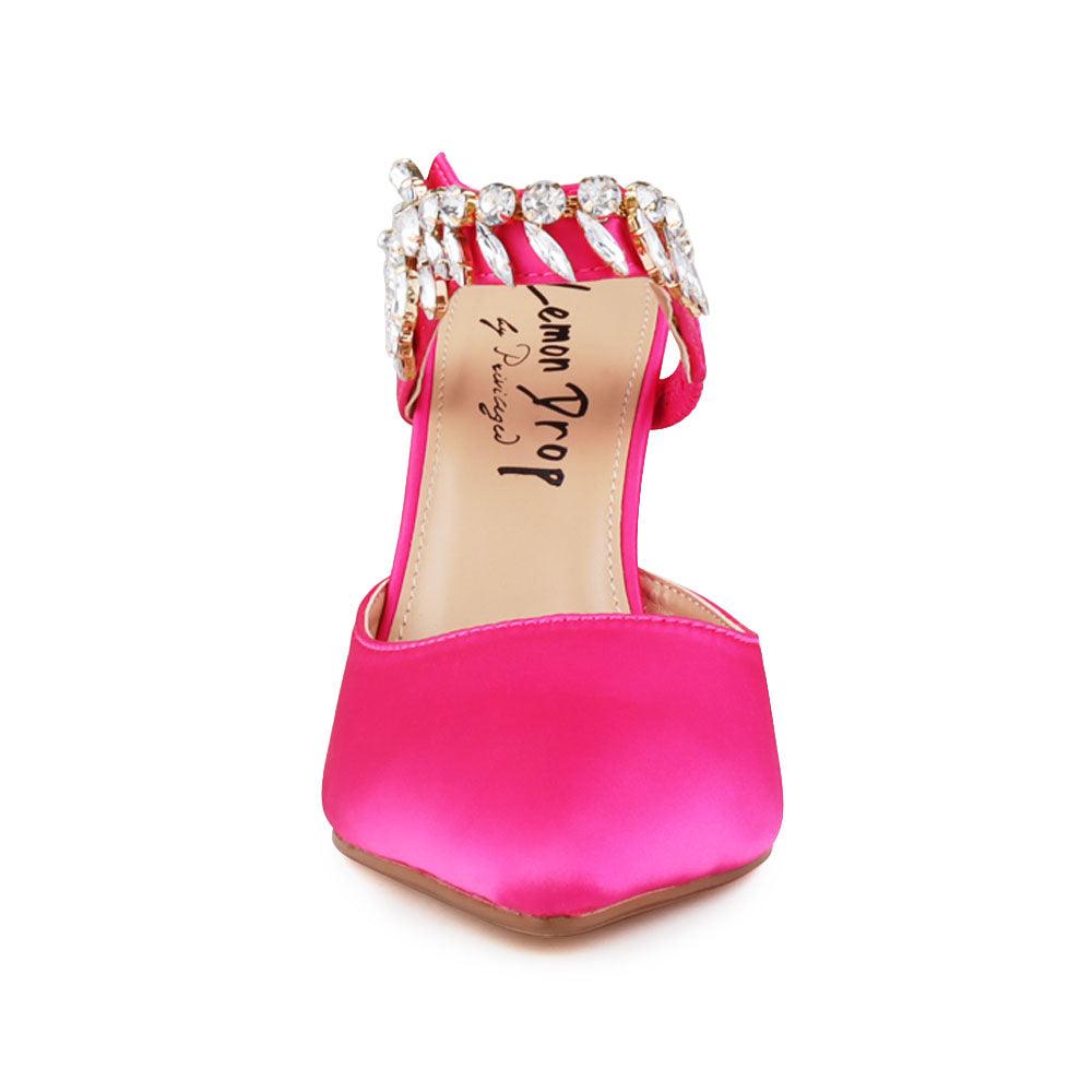 Pink colored women heels with slip-on desgin and a silver motive strap-front view