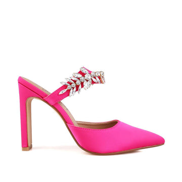 Pink colored women heels with slip-on desgin and a silver motive strap-side view