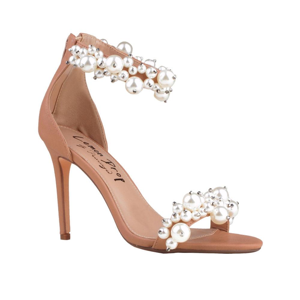 Tan colored women heels with pearl embellished ankle buckle and upper-corner view