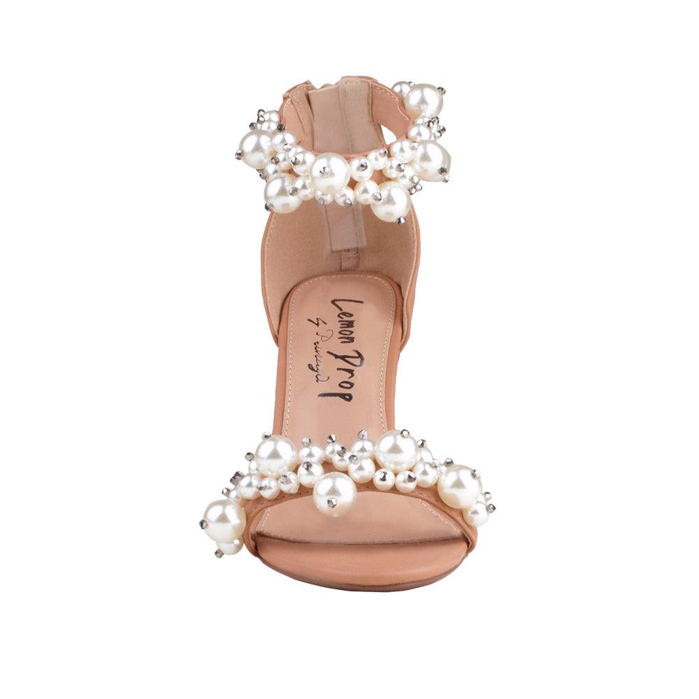 Tan colored women heels with pearl embellished ankle buckle and upper-front view