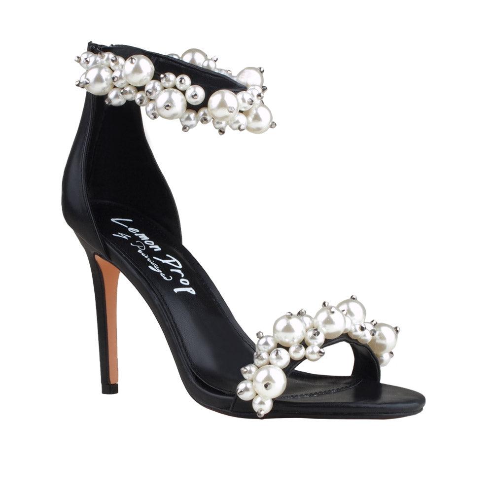 Black women heels with pearl embellished ankle buckle and upper-corner view