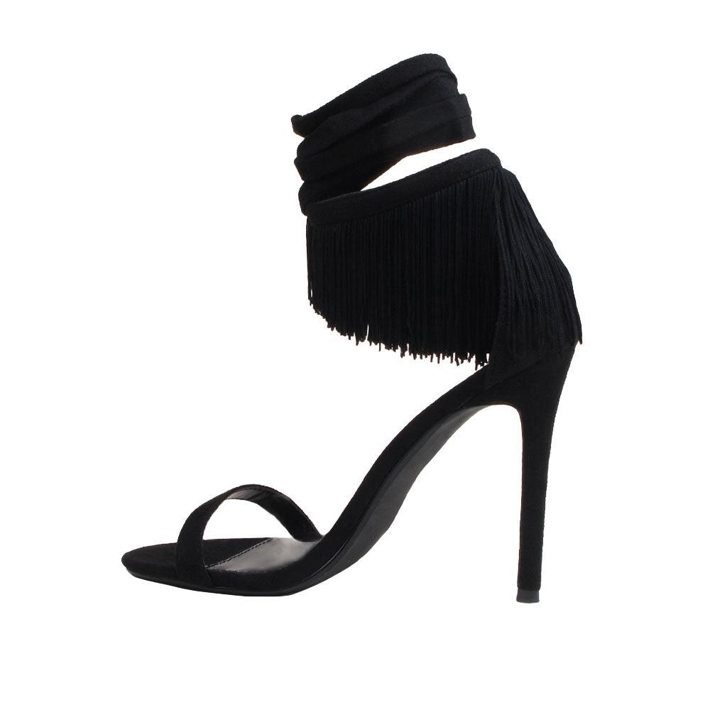 black colored women heels with fringes on ankle buckle-posterior view