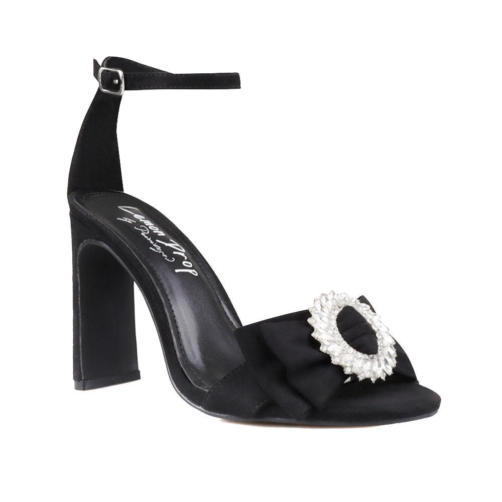 Black colored women heels with silver bow on upper-corner view