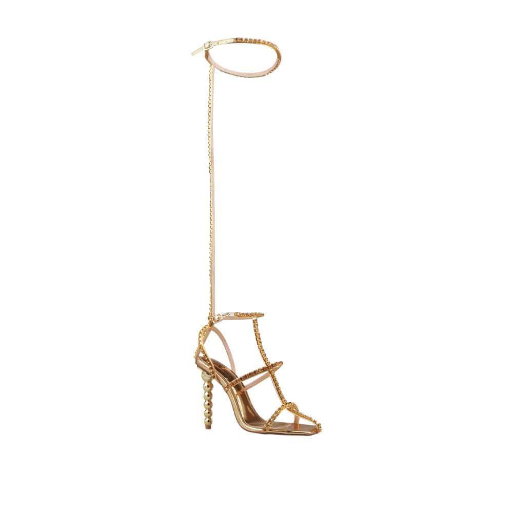 Ankle and thigh buckle closure women's heel with rhinestones in gold-corner view