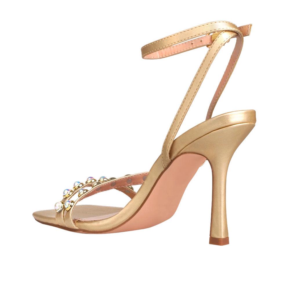 Women heels in gold with pearls-posterior view