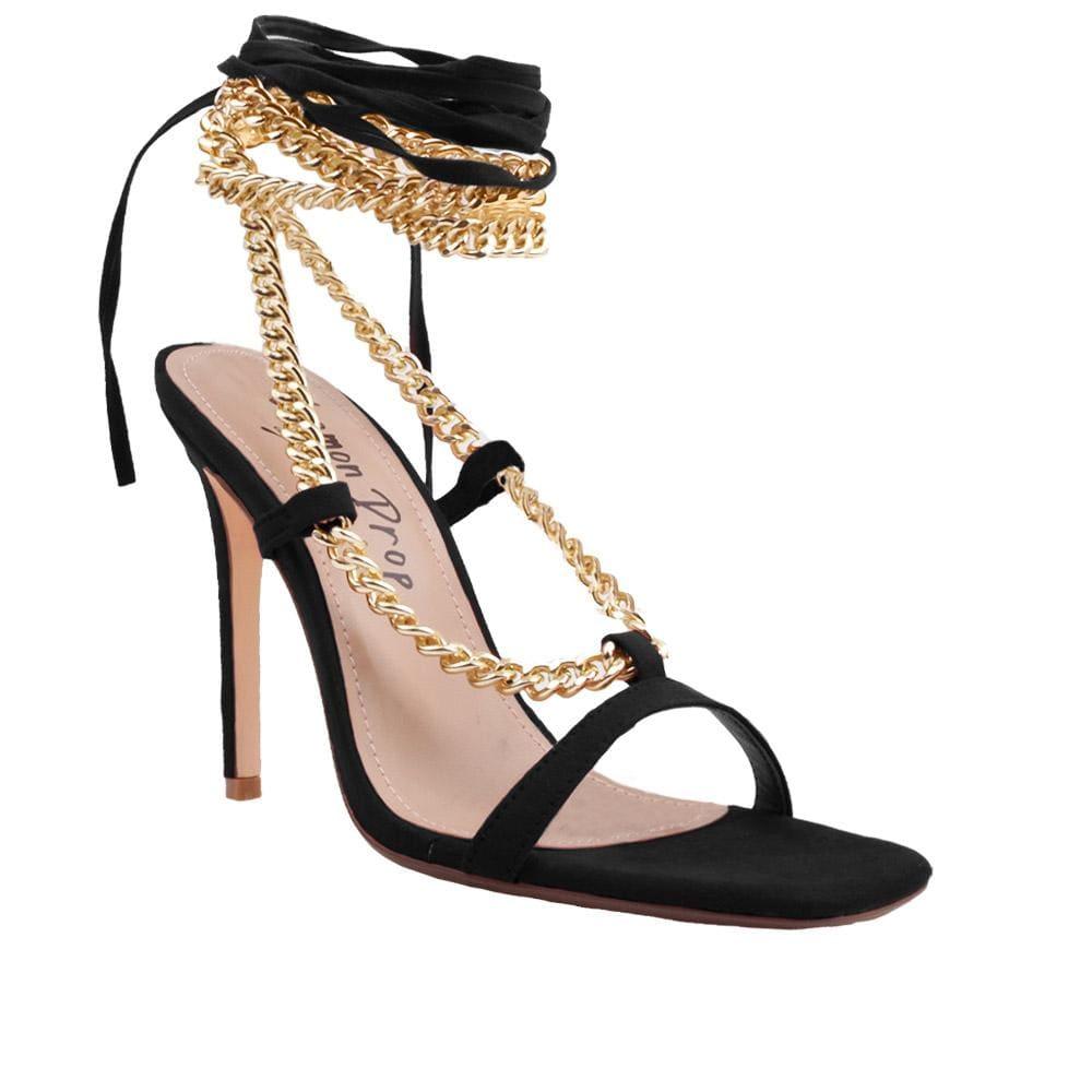 Women heels with gold metal chains and lace tie up in black-corner view